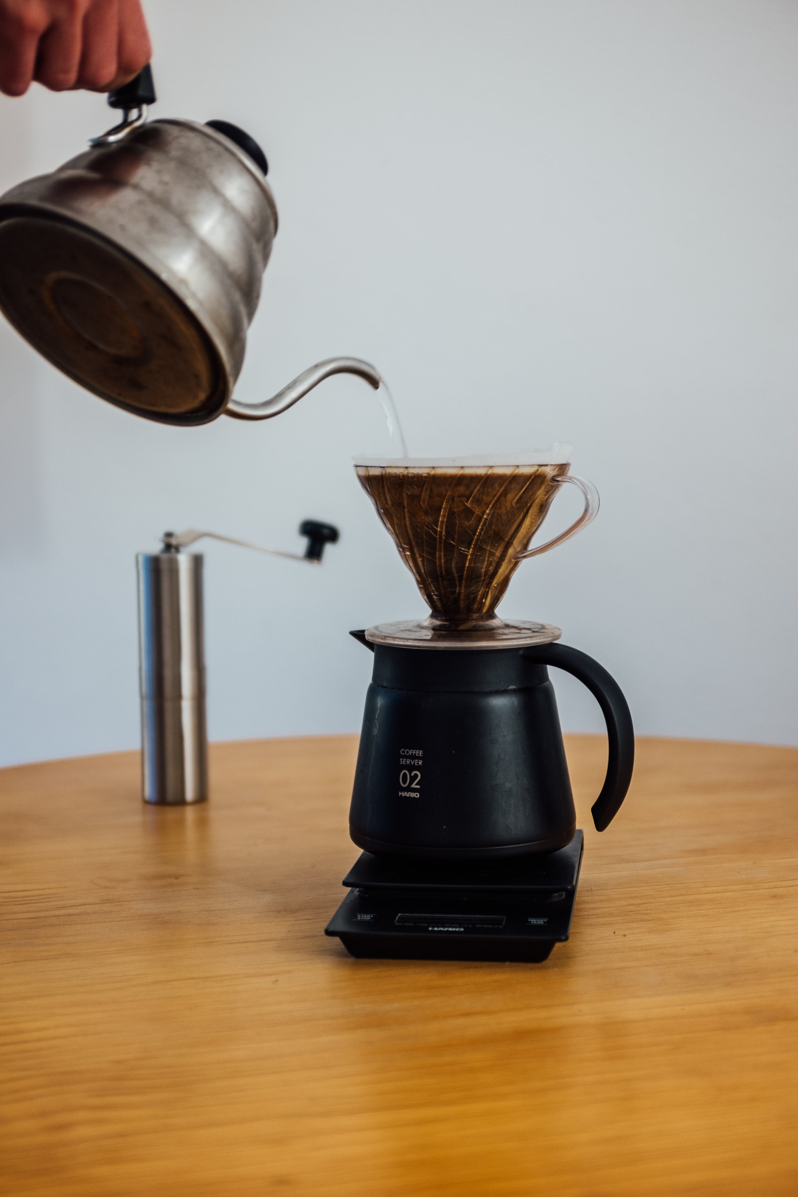 wooden-table-with-a-scale-and-pour-over-coffee.jpg